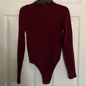 Long Sleeve Bodysuit With Crop in the Back.